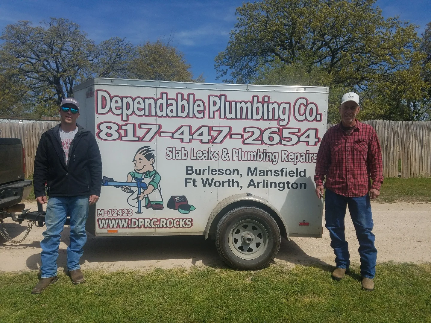 Don and his son Brad of Dependable Plumbing Company standing in front of their service trailer in Burleson, Texas — Texas Master License M12423