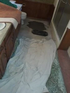 Burleson slab leak repair — tarping the floors to keep the home clean during the repair