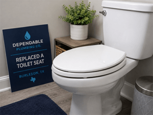 Plumber installing a new toilet seat in a Burleson, TX home