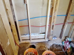 Bathtub drain relocated through an opened concrete slab with new water lines in a Burleson, TX bathroom remodel