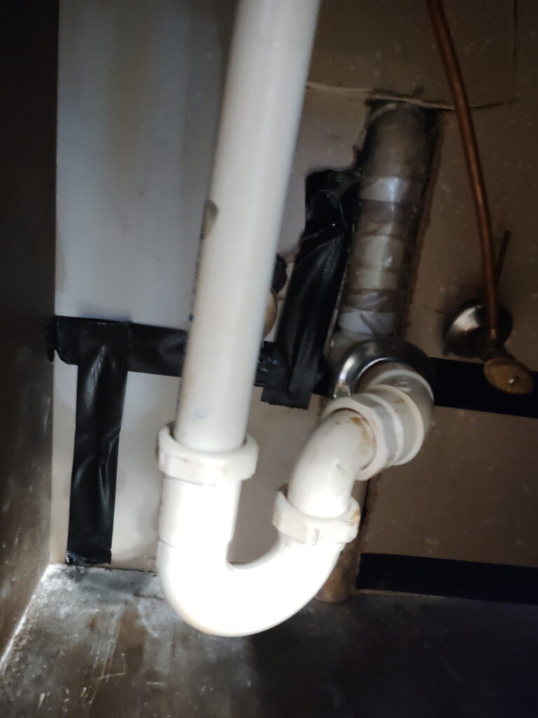 Rerouted and insulated hot water line run overhead through a wall cavity after a slab leak repair in Burleson, TX