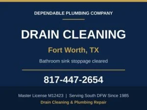 Plumber clearing a stopped up bathroom lavatory drain at a Fort Worth, TX home