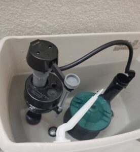 Replaced fill valve and flapper inside a toilet tank after a running toilet repair in Burleson, TX